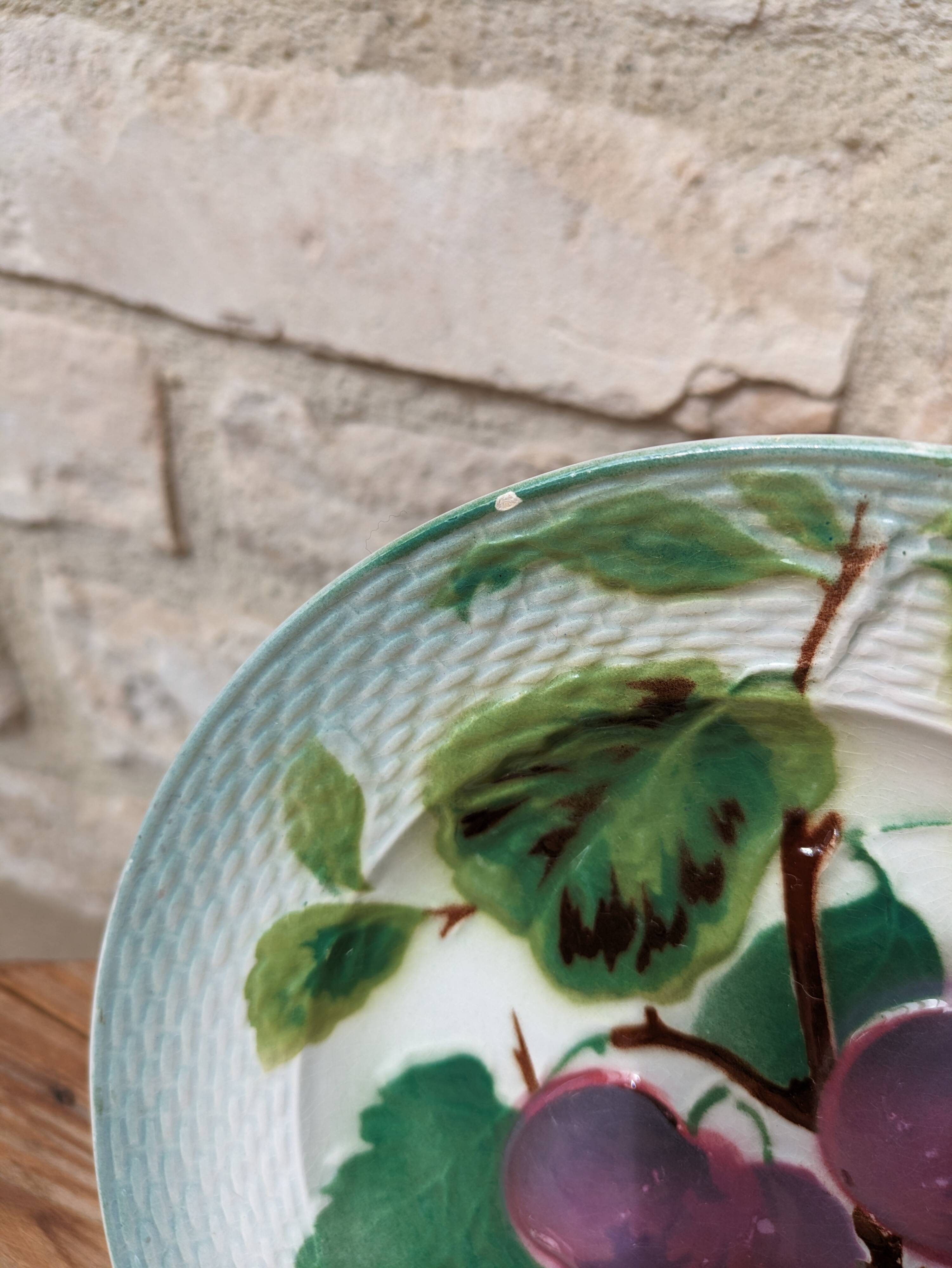 Old barbotine plate with plum motif Saint Amand Hamage