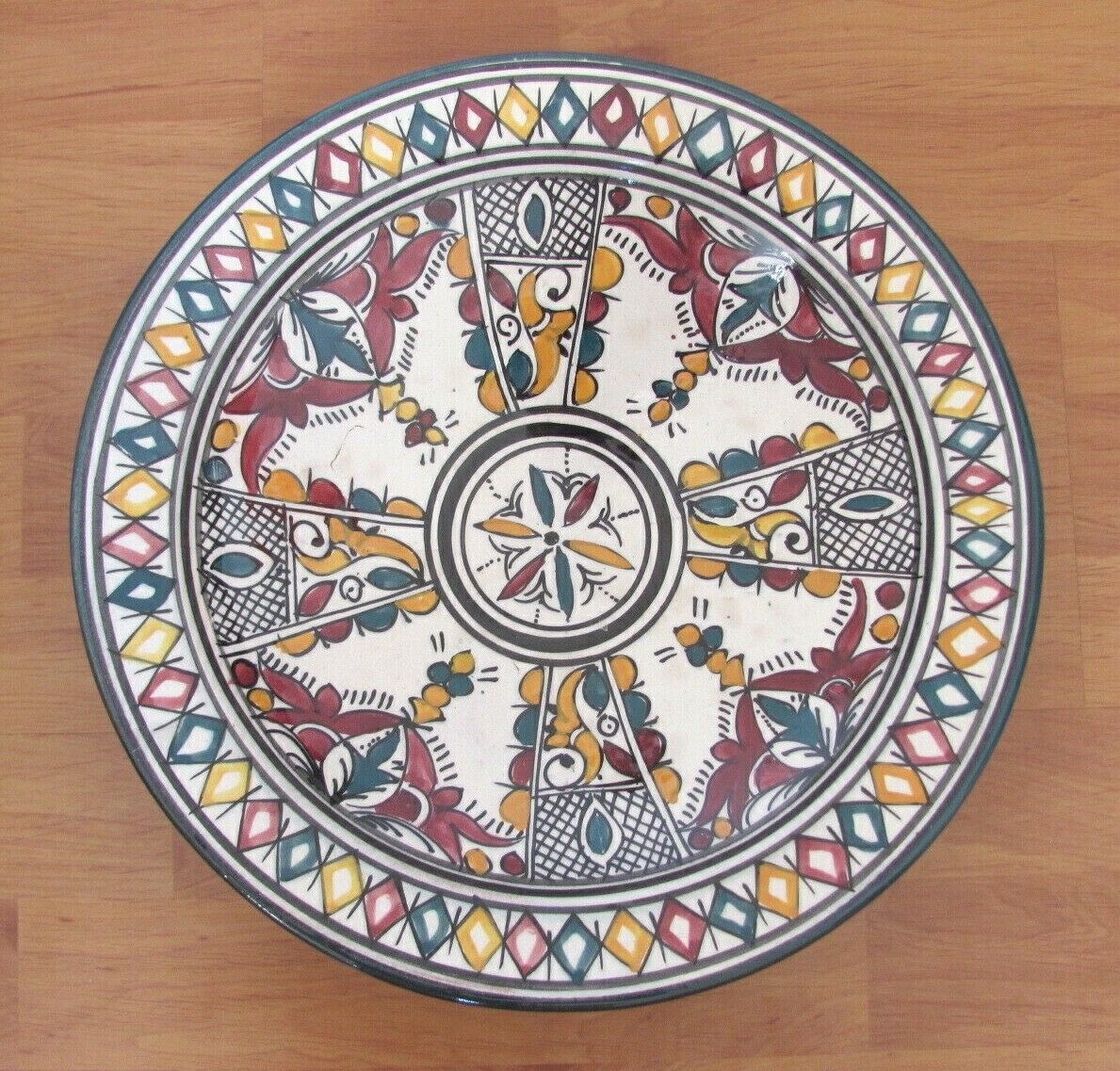 Ceramic dish decorated with yellow and purple decoration