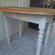 Oval table with beaded grey patinated flaps, wooden tray