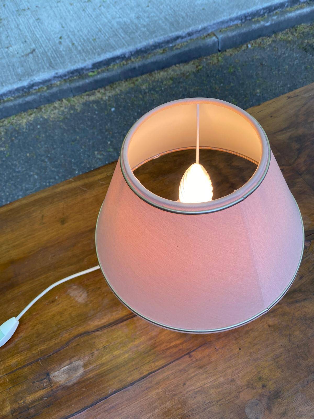 Vintage green ceramic bedside lamp with a pink-beige lampshade.