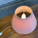 Vintage green ceramic bedside lamp with a pink-beige lampshade.