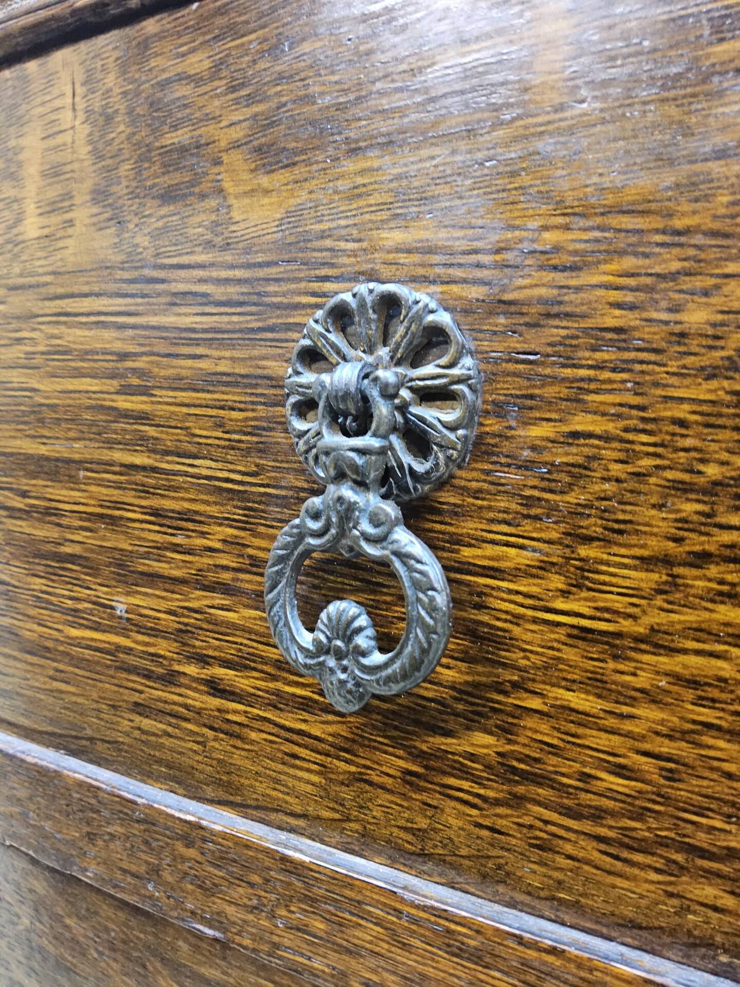 Antique chest of drawers on wheels with wood carving (key top drawer)