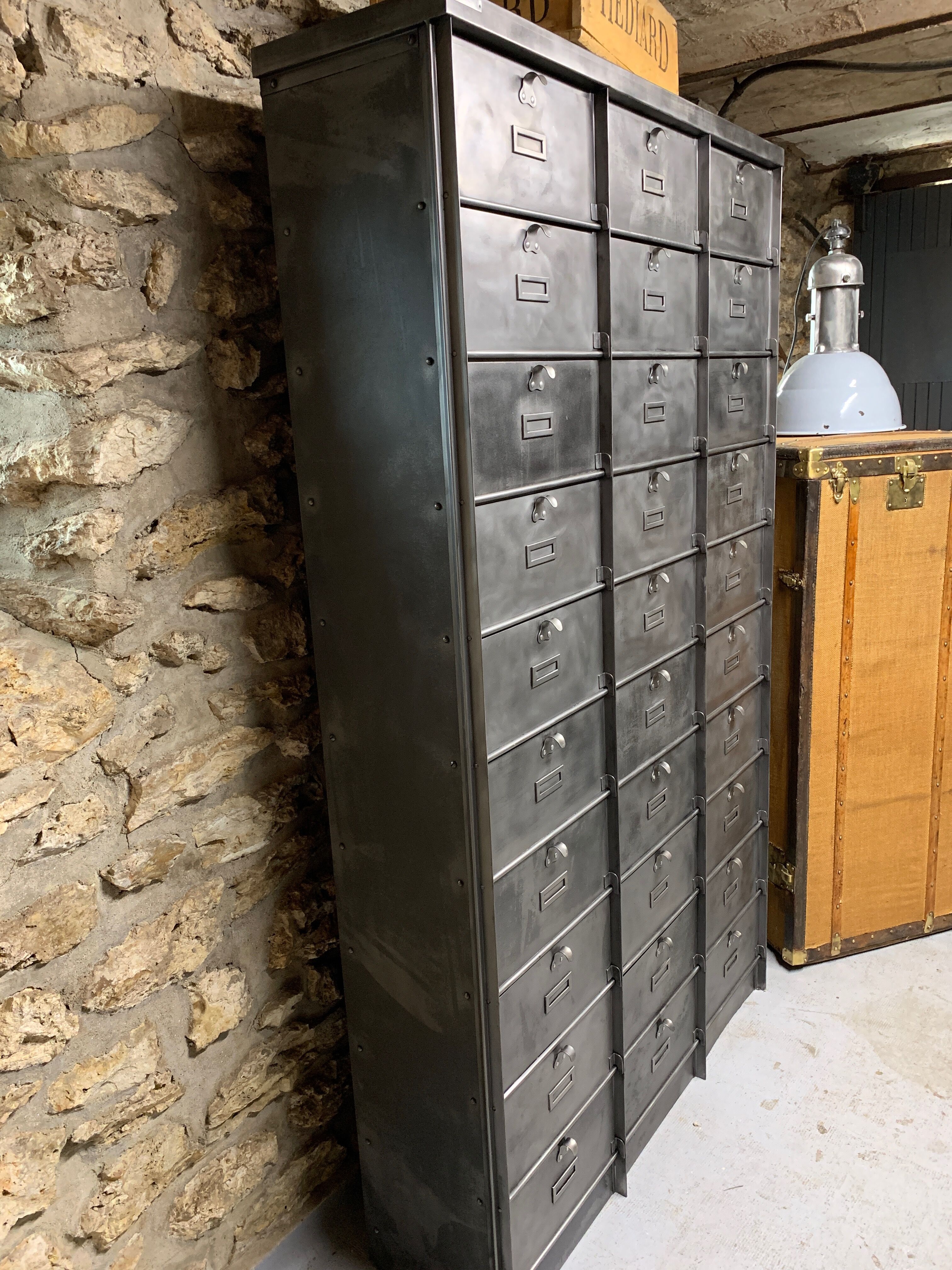 Industrial cladding furniture in brushed and patinated steel