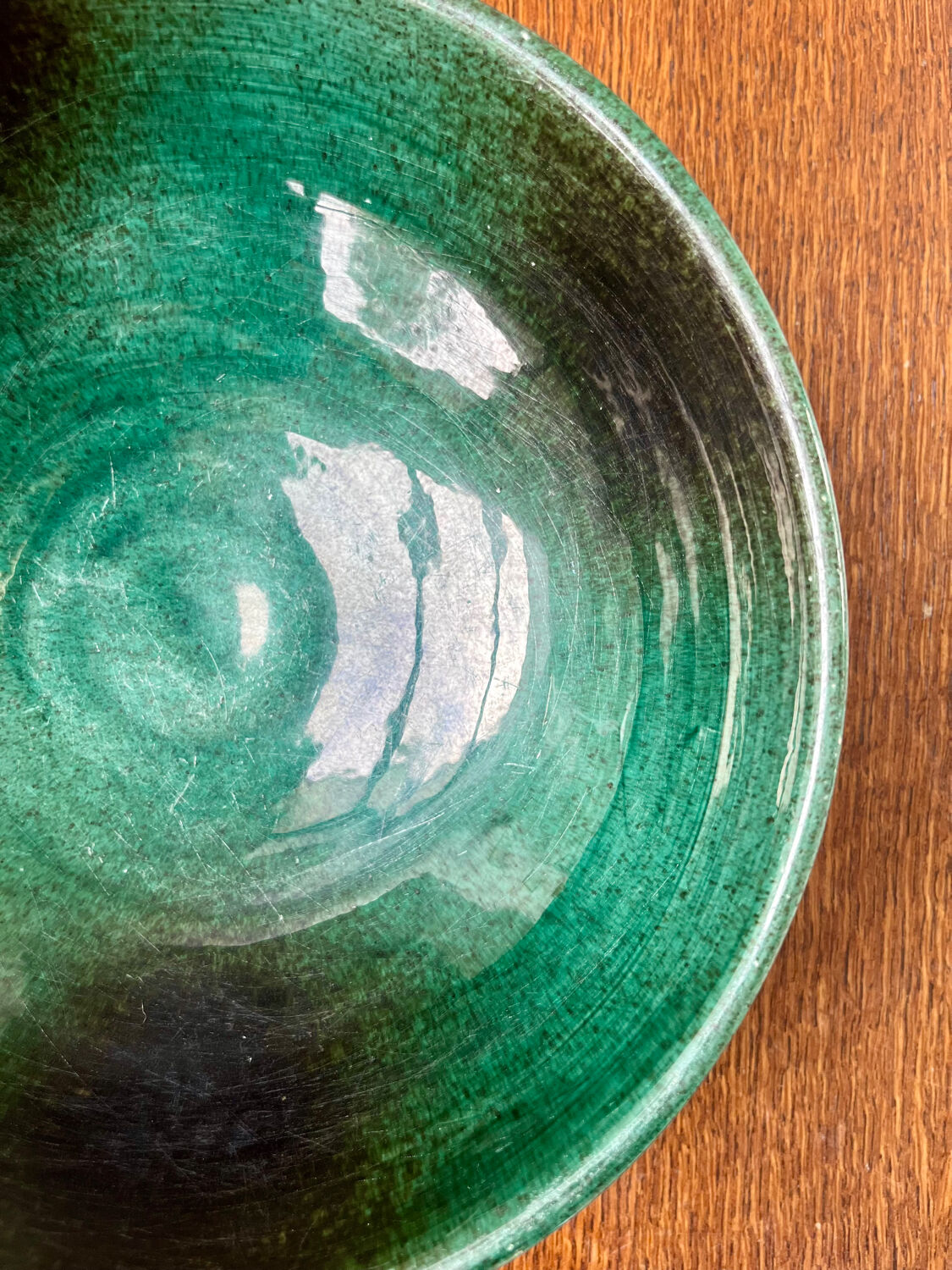 Green glazed ceramic bowl, signed Idlas.