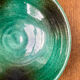 Green glazed ceramic bowl, signed Idlas.