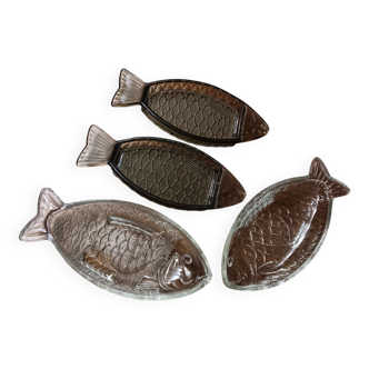 Set of 4 transparent glass raviers in the shape of fish.