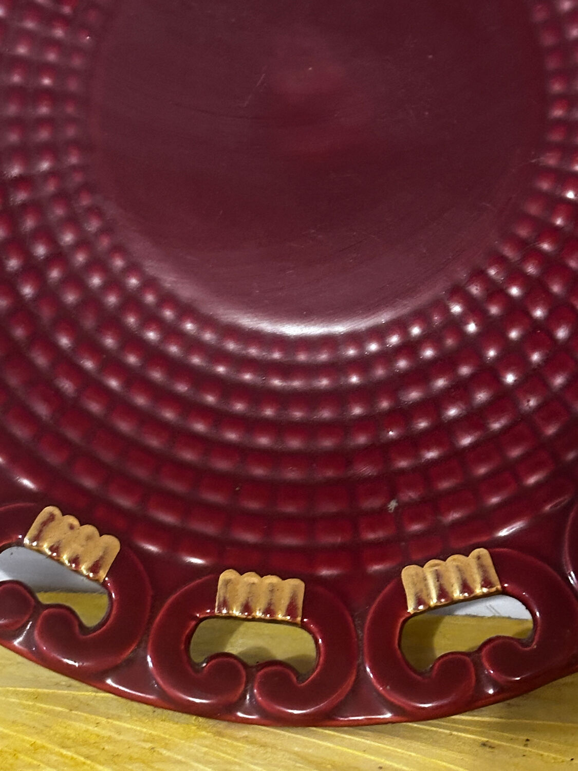 Burgundy and gold openwork plate in ceramic from Saint-Clement, 1950s.