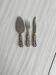 Antique shiny metal cheese cutlery