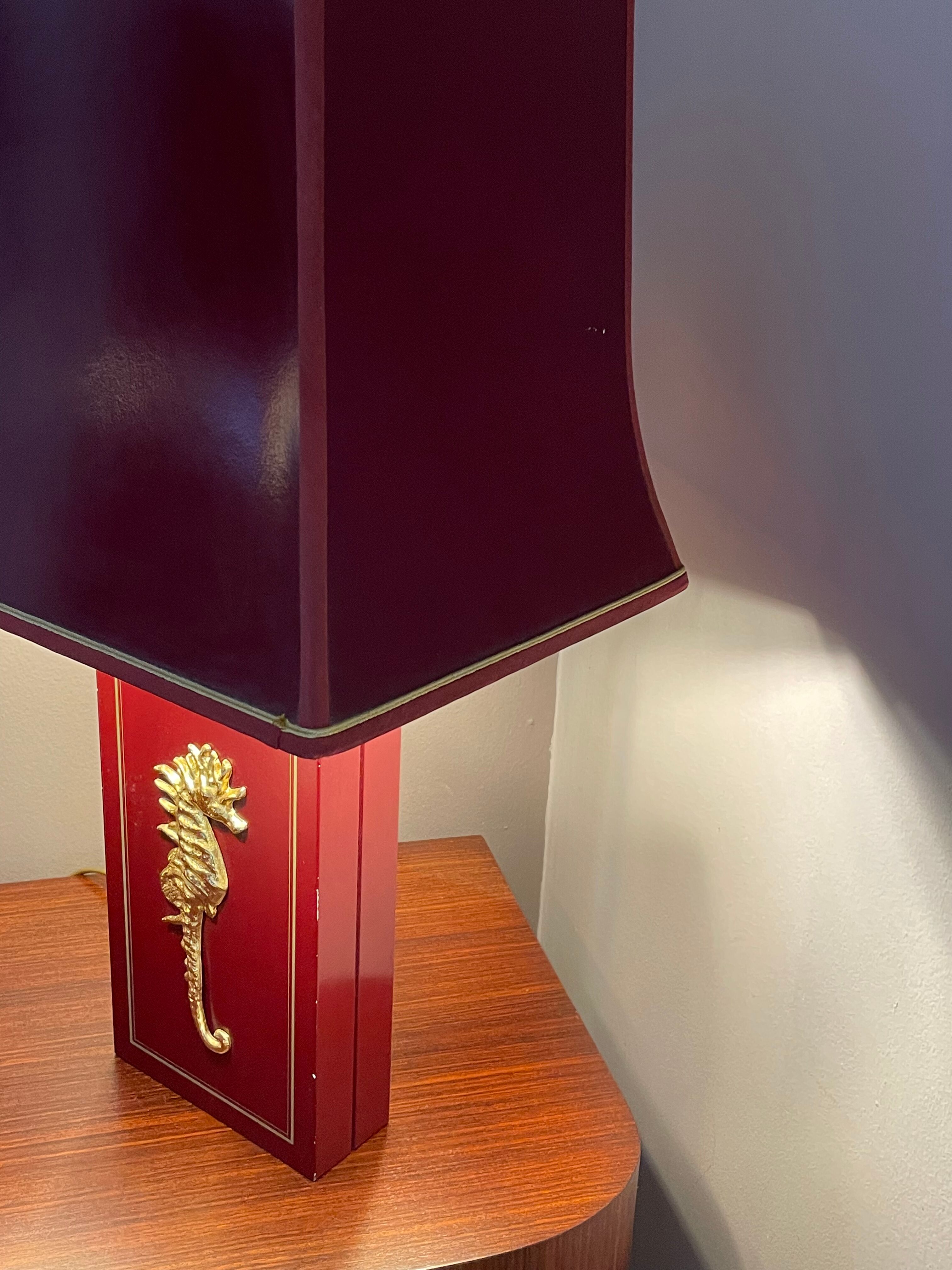 Pair of table lamps in Bordeaux lacquered wood and brass seahorse