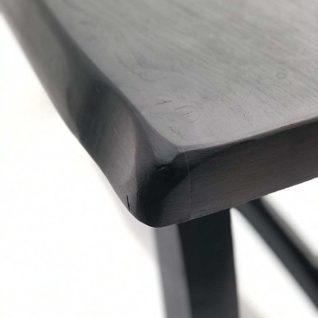 Black brutalist wooden table