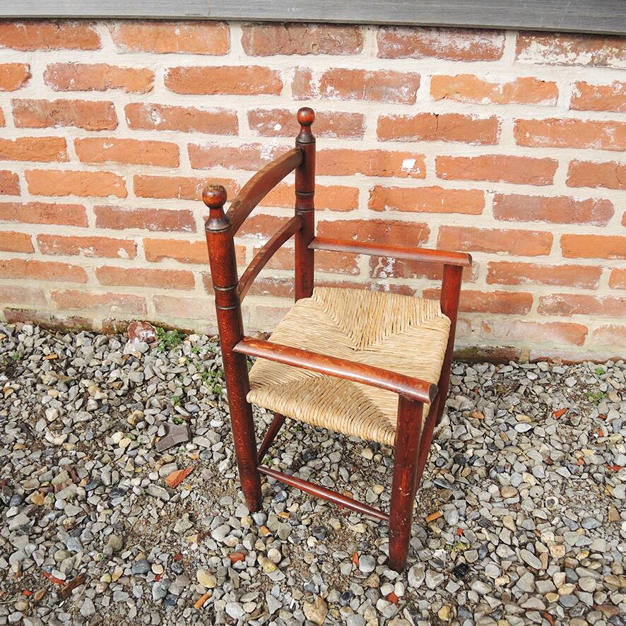 Old straw armchair for children