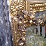 Wooden fireplace mirror and Gilded Louis XVI-style plaster with leaf