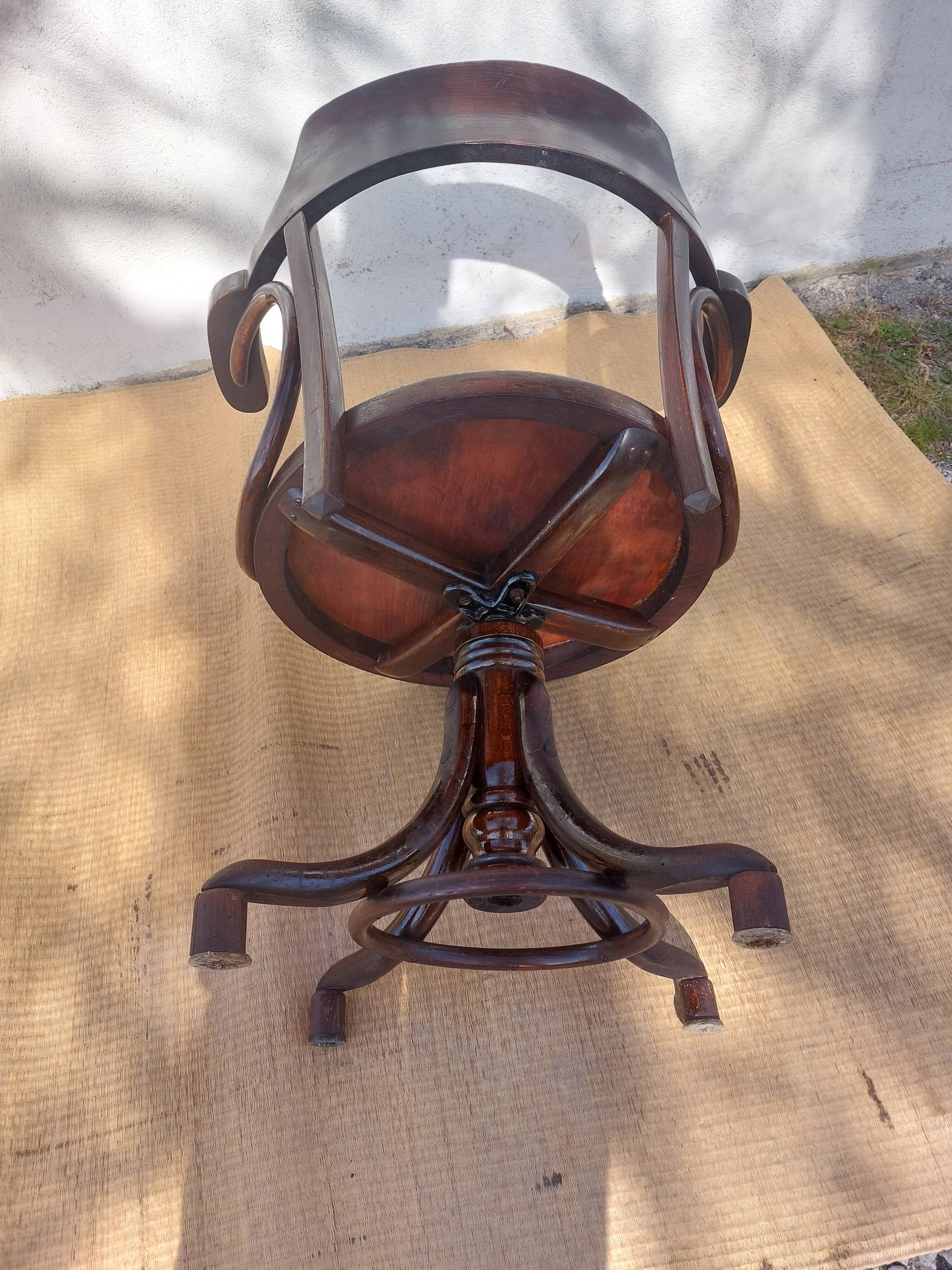 Swivel wooden armchair, pattern on seat