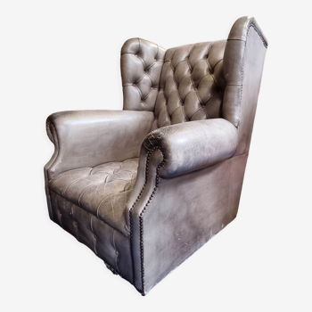 Fauteuil chesterfield en cuir gris