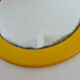 Round wall mounted mirror in yellow plastic 1970