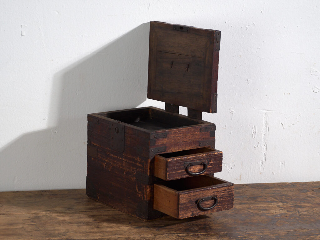 Japanese ko-dansu with hinged lid and paulownia wood drawers, Meiji–Taishō period, circa 1868–1926.