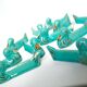 Set of 12 turquoise blue and gold duck knife holders mid-20th century