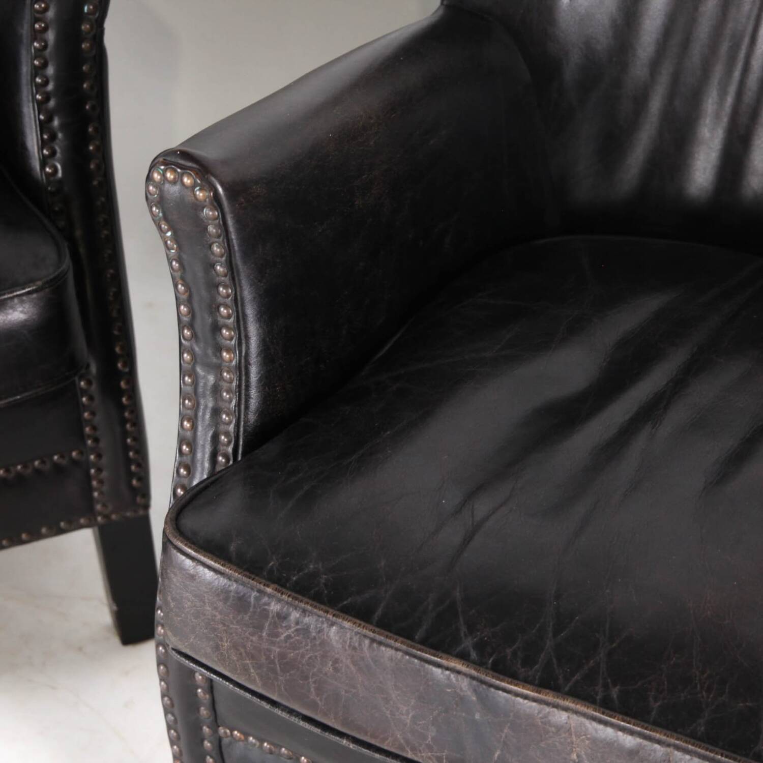 Pair of small leather club armchairs