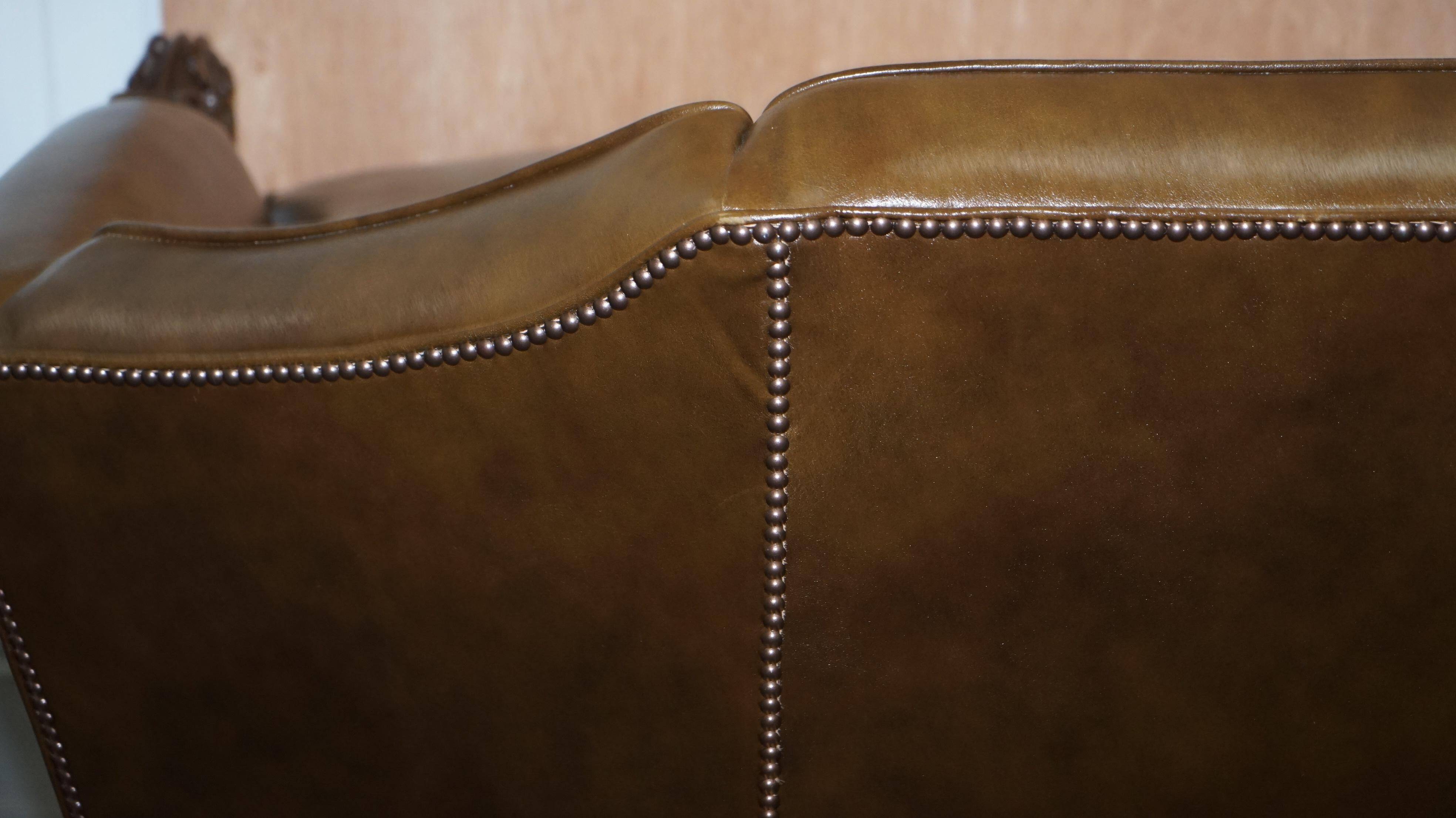 Restored Regency canapé in leather with sculpted Hermès frame.