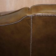 Restored Regency canapé in leather with sculpted Hermès frame.