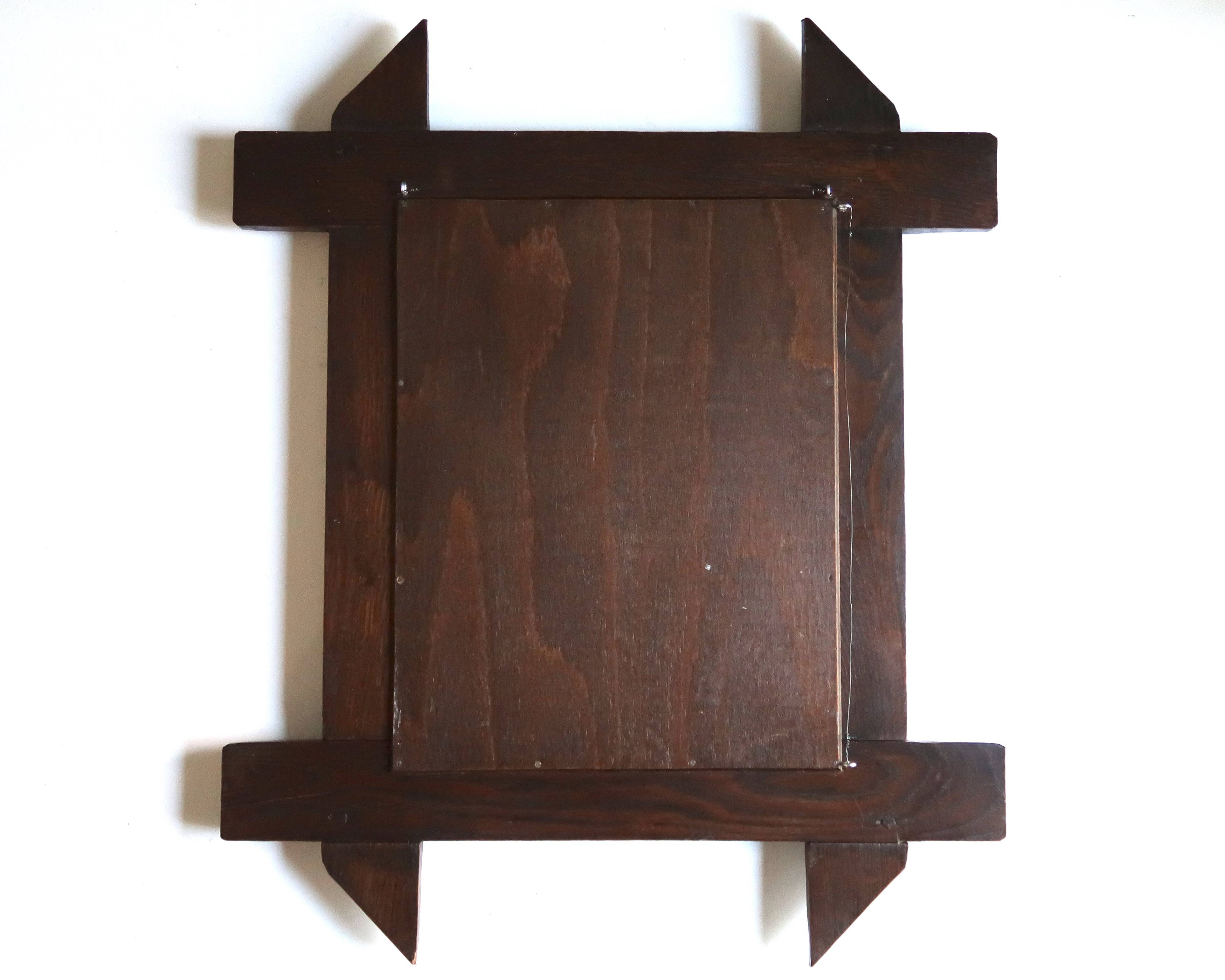 Rectangular mirror with bevelled wooden frame, 1970s.