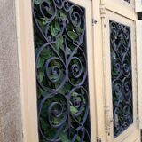 Porte d'entrée cintrée double en chêne, grilles et verre, XIXème