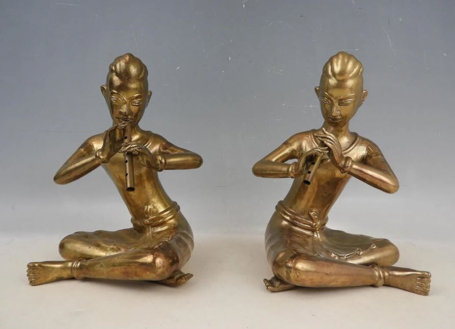Pair of bookends in brass, flute players