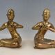 Pair of bookends in brass, flute players