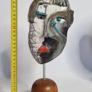 Signed raku ceramic mask on wooden base Contemporary sculpture 30 cm