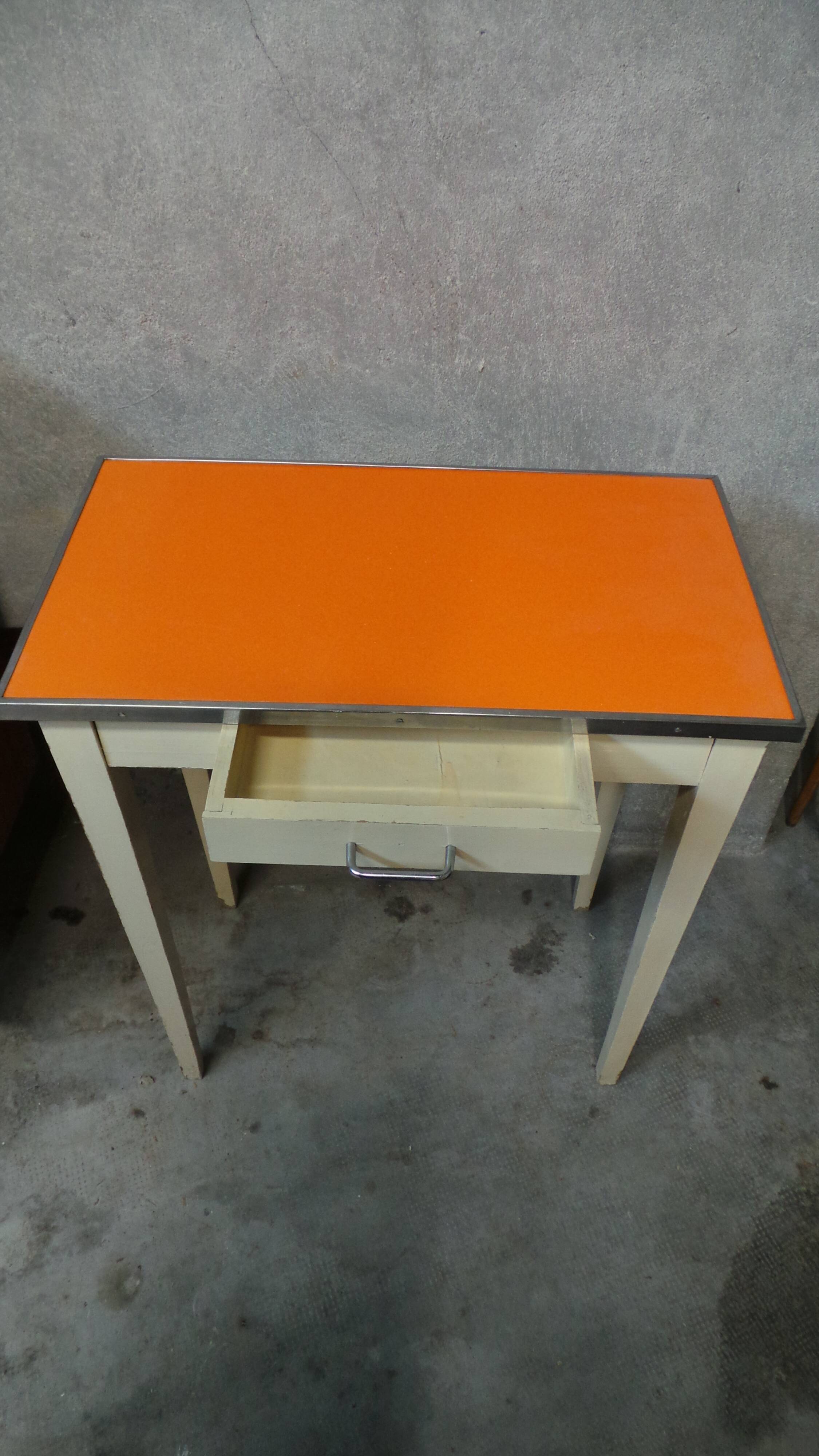 Orange wood and formica table