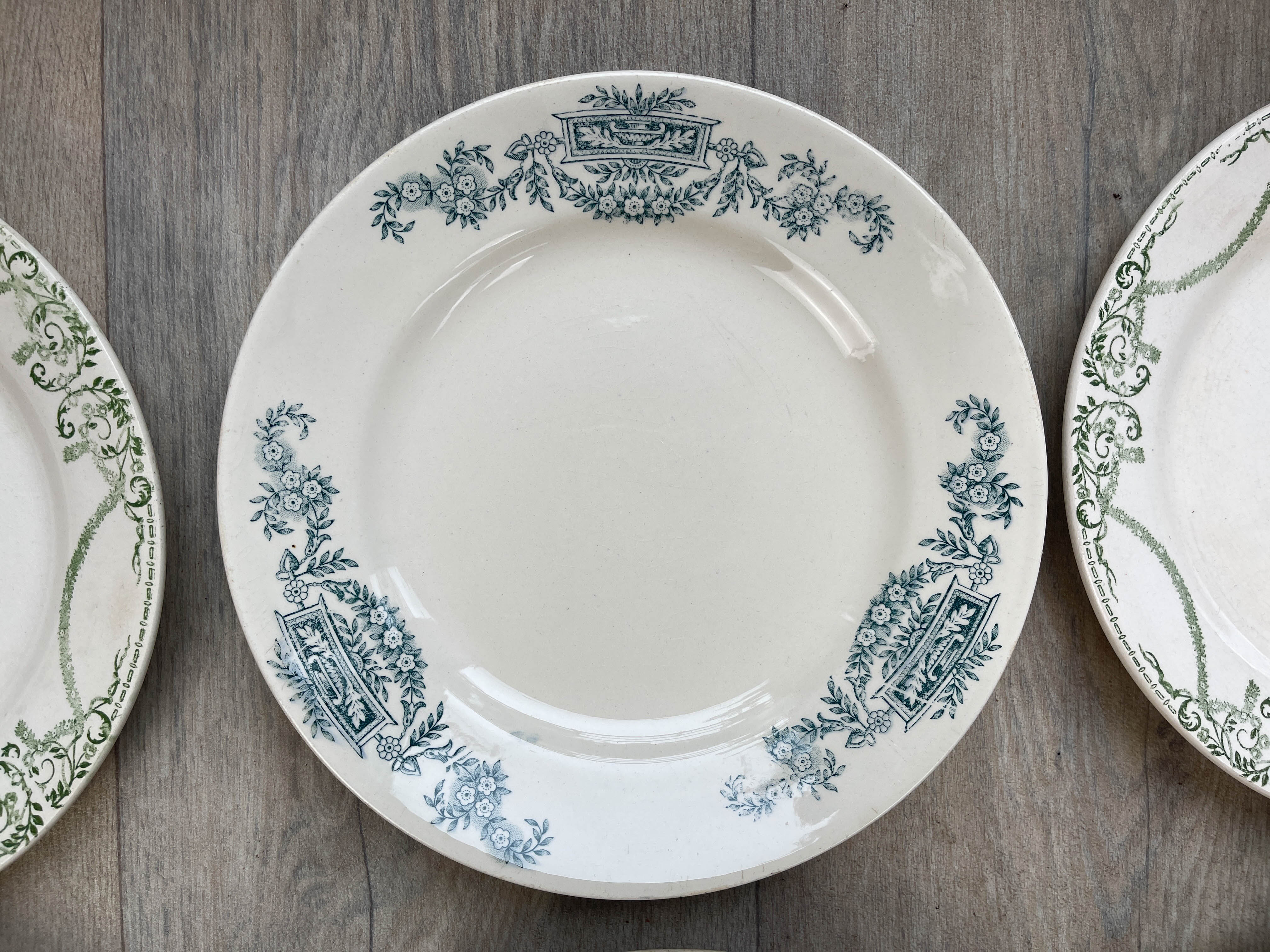 6 green and blue mismatched iron earth plates