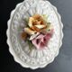 Capodimonte-style porcelain lidded sugar bowl with floral relief