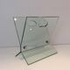 Designer magazine rack in glass and brushed steel