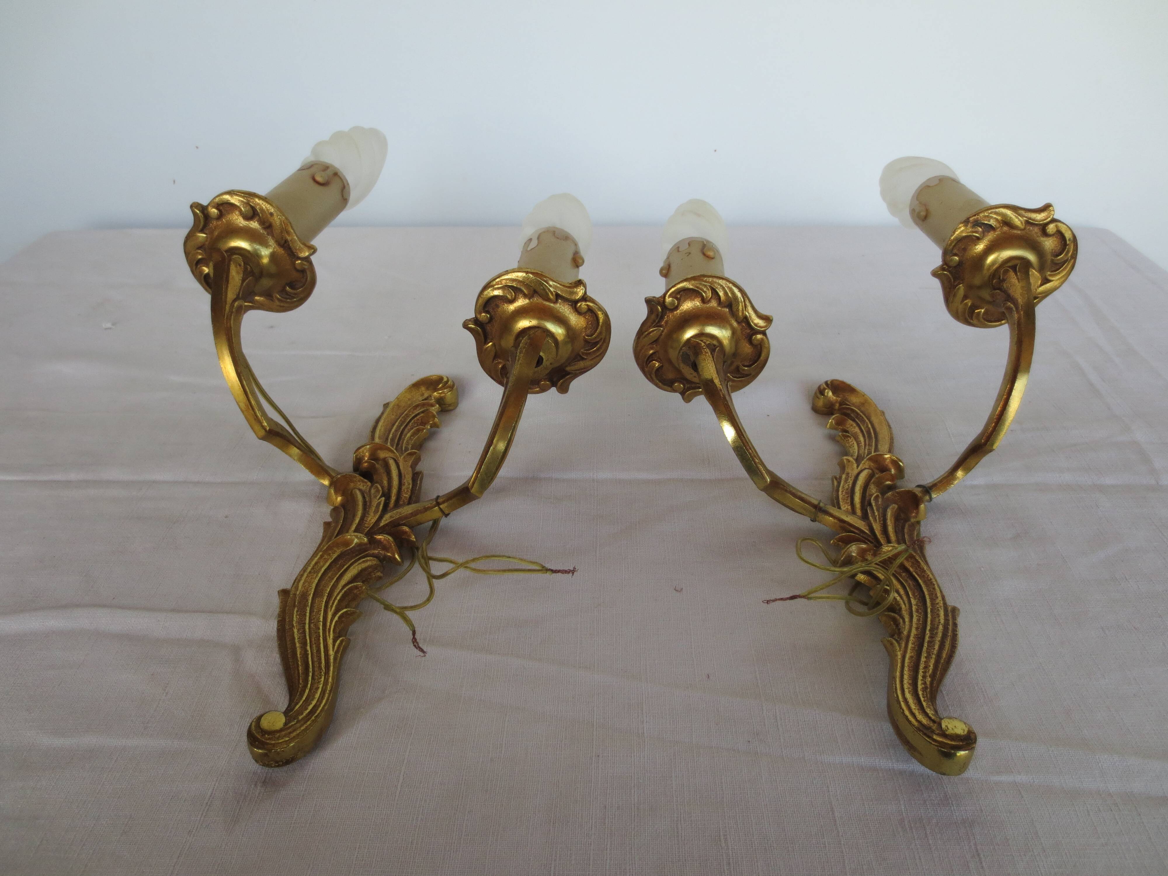 Pair of double wall lights in gilded bronze