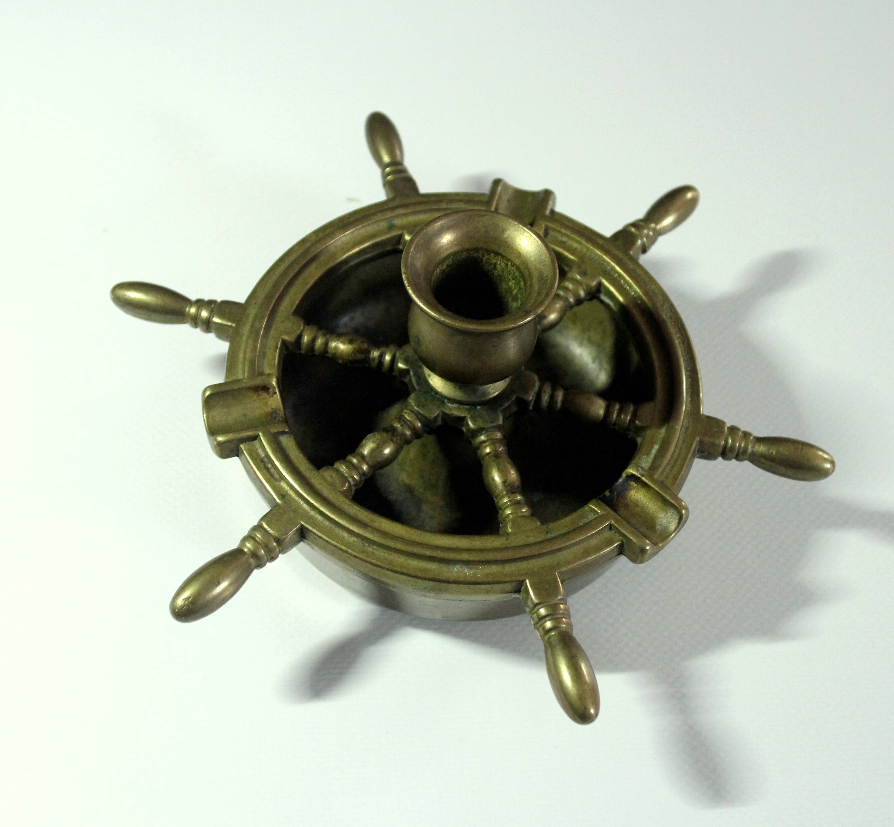 1960s solid brass ashtray in the shape of a steering wheel with a candle stick, vintage