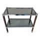 Vintage dessert table in wood, smoked glass, chrome metal, and wood.
