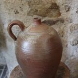 Vernified sandstone oil jar with handle