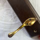 Wooden coat rack with double brass hooks