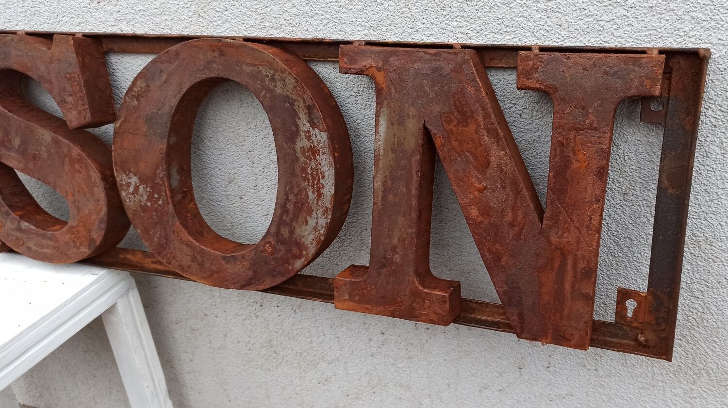 Rusty metal plate HOME