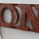Rusty metal plate HOME