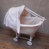 Wicker and painted wood baby cradle