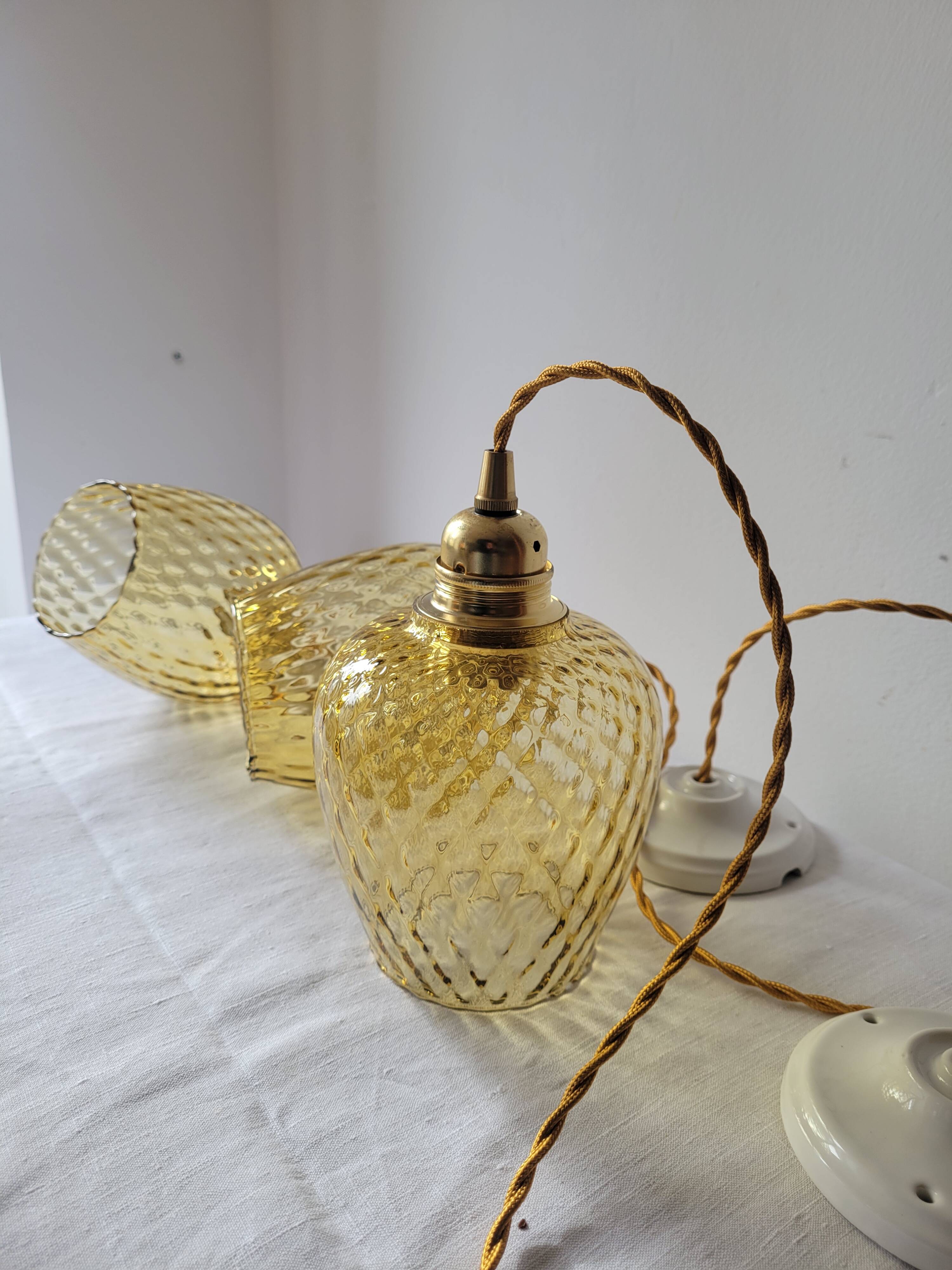 Trio of yellow glass pendant lights