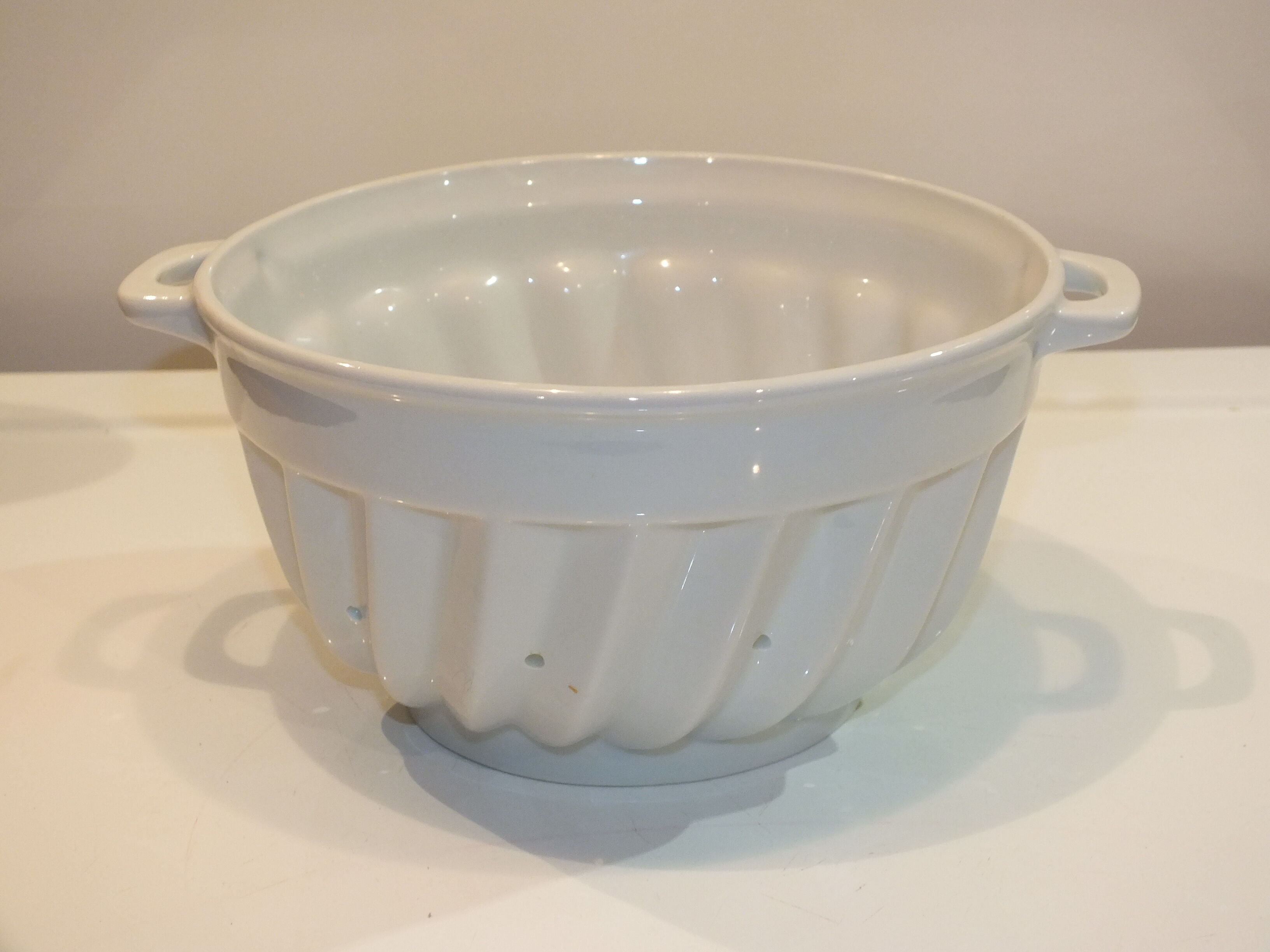 White porcelain strawberry strainer or drainer