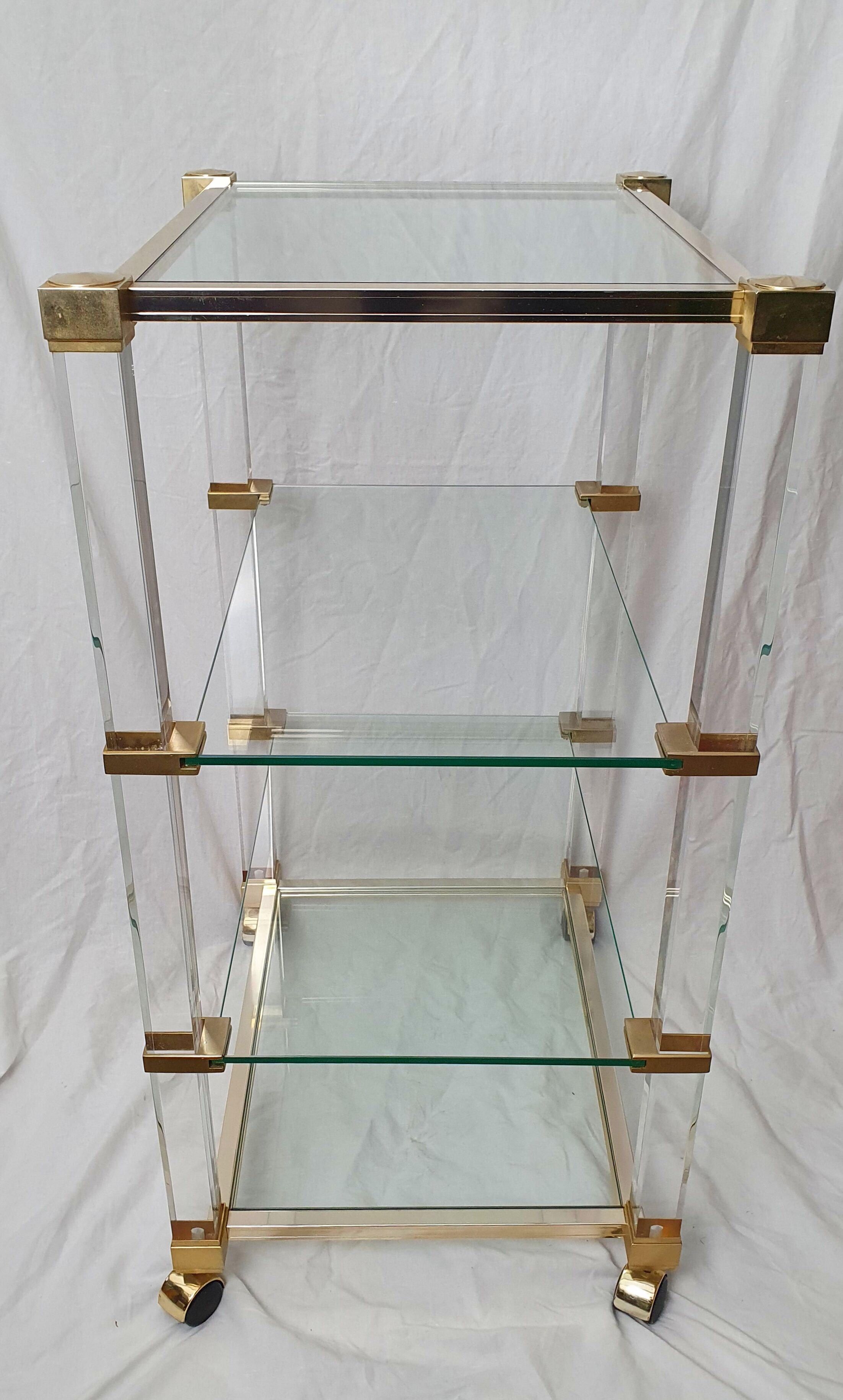 Rolling glass and plexiglass shelf by Pierre Vandel