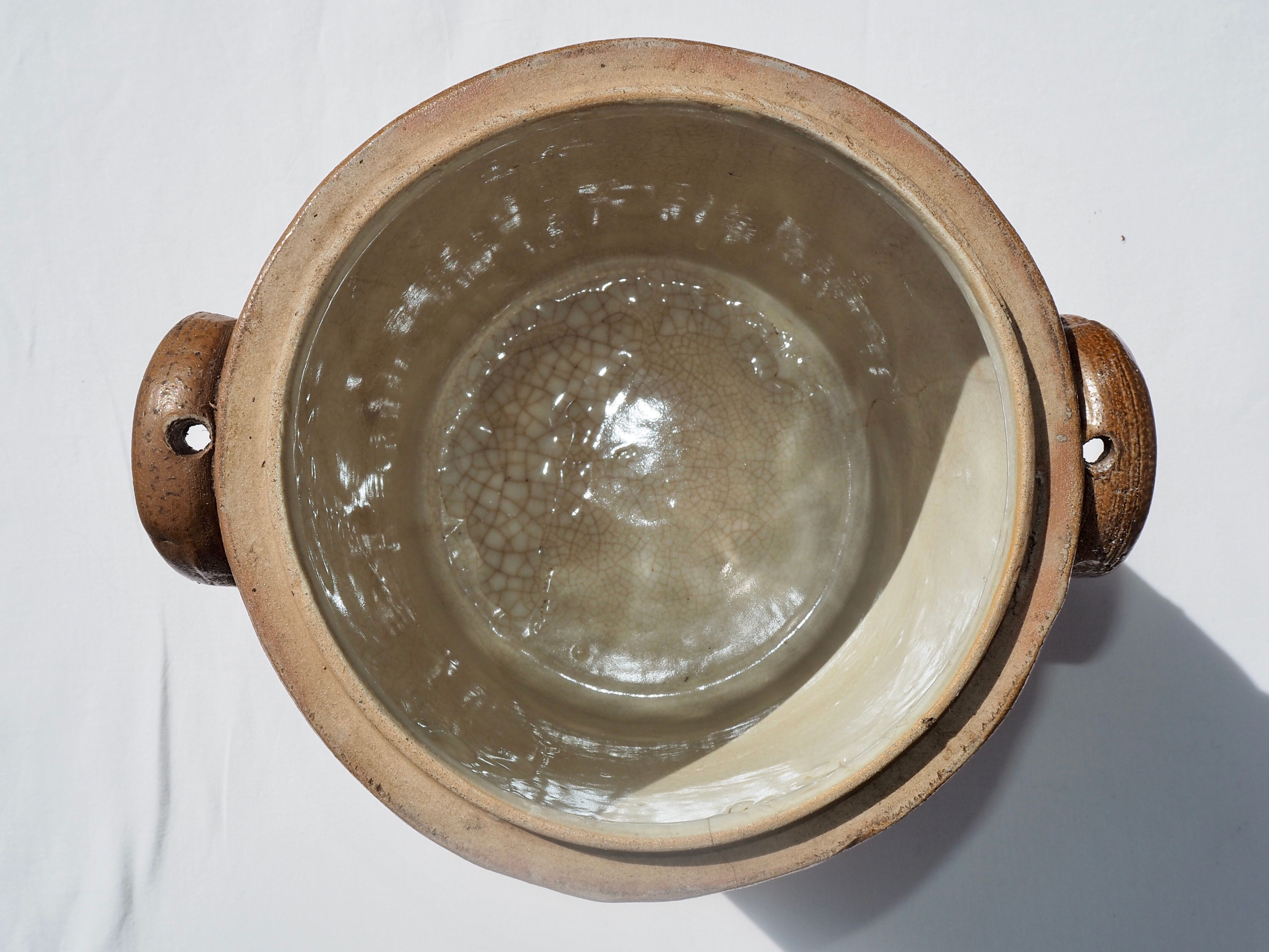 Trio of stoneware pots with lids