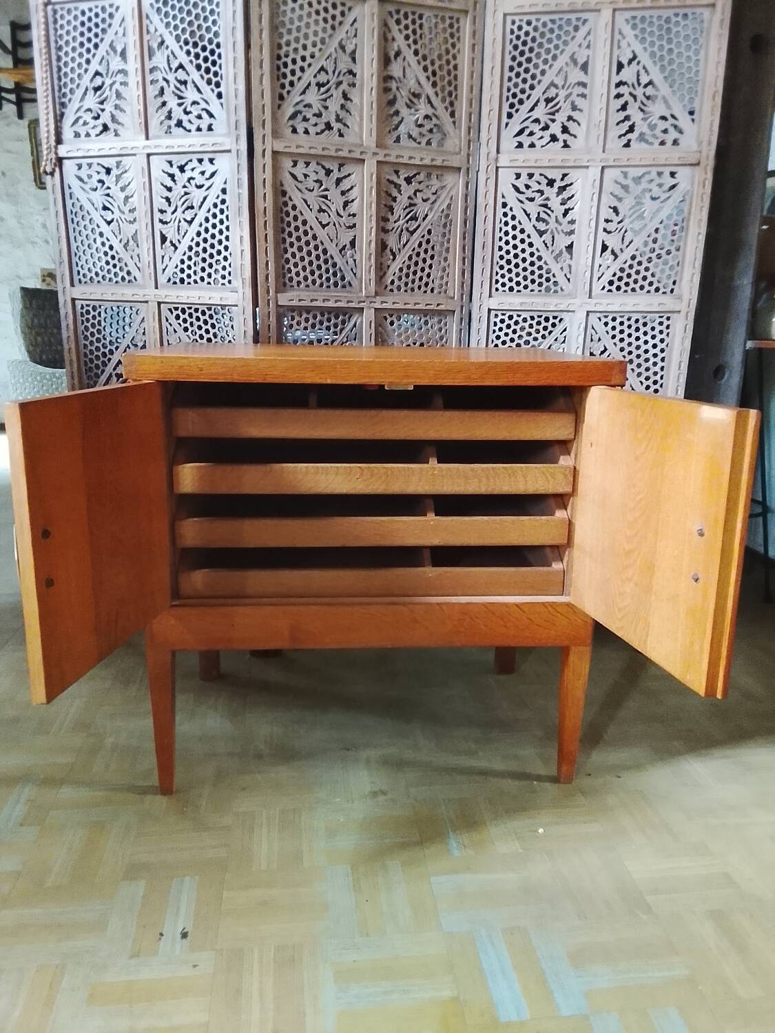 Vintage storage unit with two doors and four drawers.