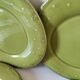 6 olive green plates with dotted relief, workshop ceramic style