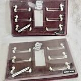 12 silver-plated metal duck knife rests with crystal.