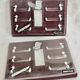 12 silver-plated metal duck knife rests with crystal.