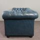 Chesterfield sofa buttoned in blue cowhide, 2.5 seats